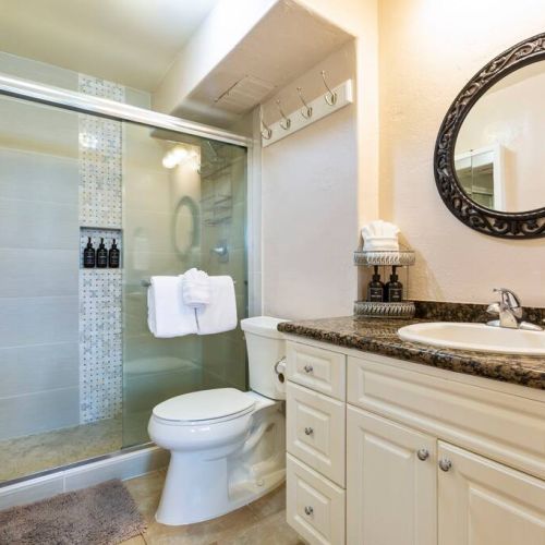 Bathroom features a full walk in shower and all essentials provided by Stay Aloha.