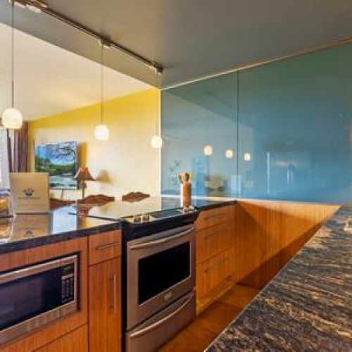 Beautiful kitchen  area overlooking living room and lanai