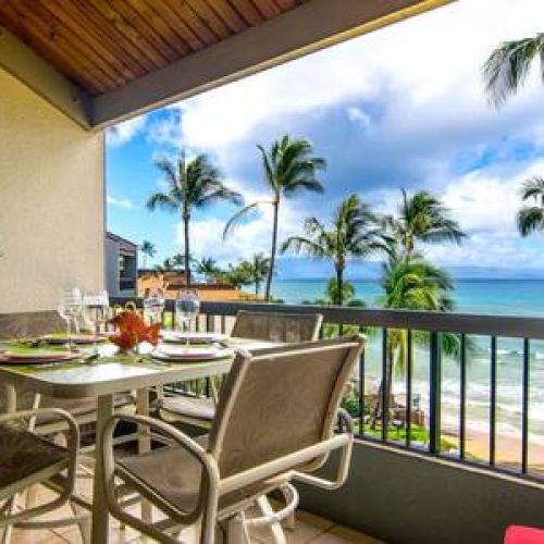Dining table for 4, love seat outdoor sofa, and a sun lounger on this large private lanai.