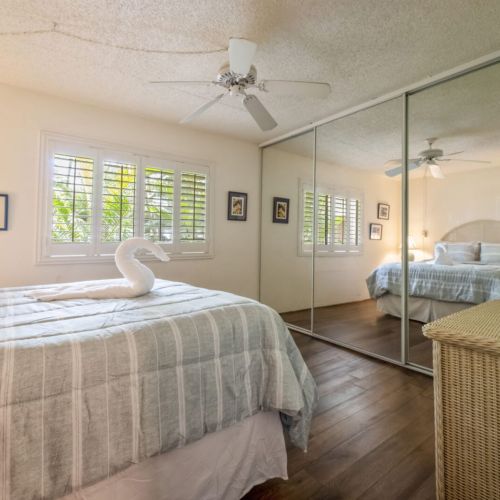 Bedroom features Queen bed, ceiling fan,