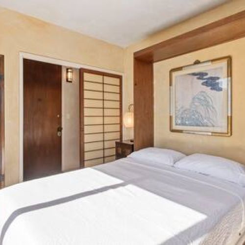 Front bedroom has a small library, queen size bed, and closet space