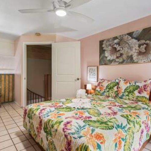 Upstairs loft bedroom features King size bed, usb nightstand chargers, split AC, and ceiling fan.