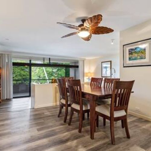 Dining area, kitchen entry, and steps down to the living room
