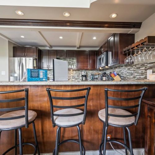 Kitchen island with bar stool seating. Condo also has a printer for your use.