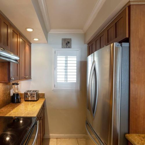 Remodeled kitchen with upgraded stainless appliances.