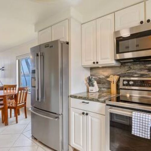 Upgraded appliances in this updated kitchen