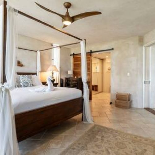 Suite features pocket doors to close off from the living room and an en suite bathroom