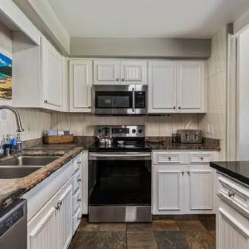 Clean fully equipped kitchen ready for a home cooked meal