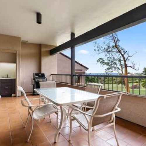 Ocean view lanai with wet bar, BBQ, and dining area.
