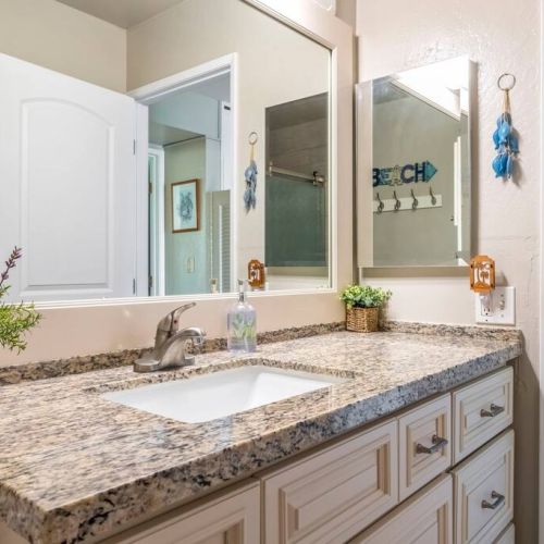 Clean bright bathroom with beach vibes.