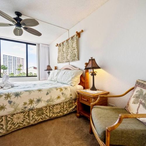 Master bedroom features king size bed, sitting chair, ceiling fan, central AC, and TV.