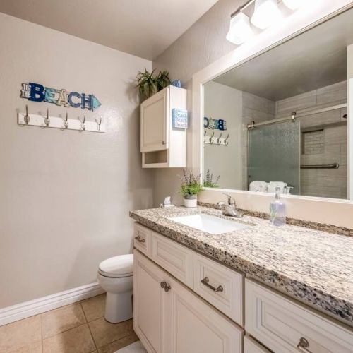 Single sink vanity with plenty of storage.