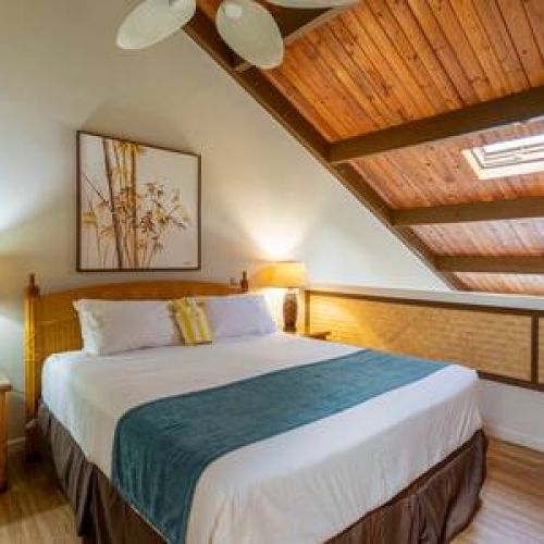 Open air loft style primary bedroom