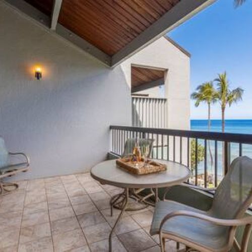 Large private lanai with ocean view and seating for 4 people