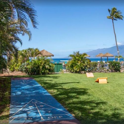 Shuffle board and corn hole on property