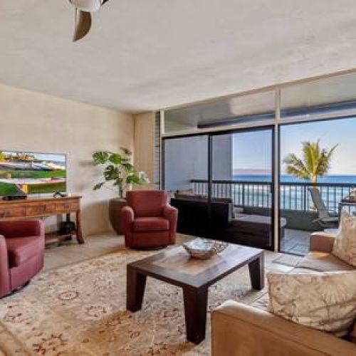 Stunning ocean view from the living area in this private corner condo.
