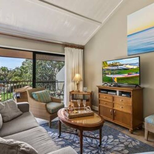 Living area and large private lanai overlook courtyard and pool area