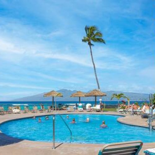 Royal Kahana Resort pool area with plenty of seating and an ocean view
