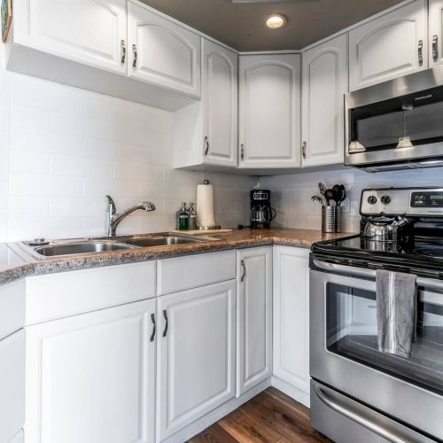 Freshly painted kitchen with upgraded stainless appliances.