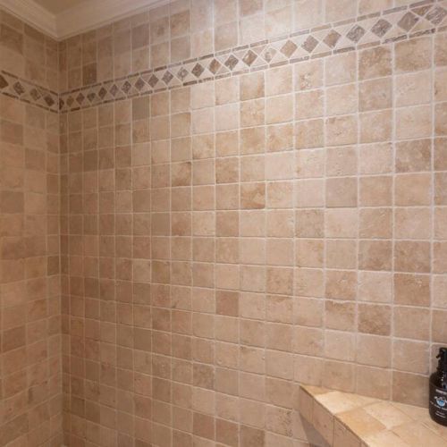 Walk in dual faucet shower with organic lux bath essentials.