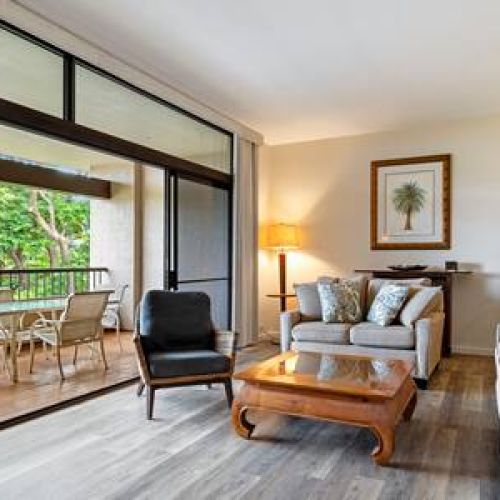 Beautiful coastal style sunken living room leading to lanai