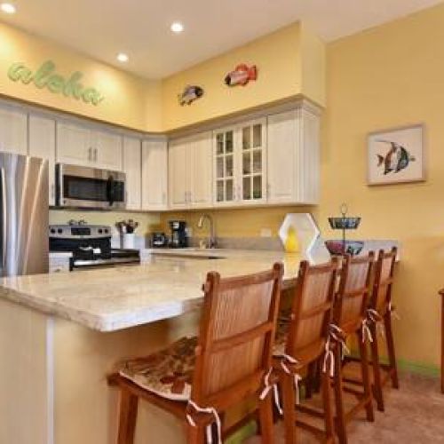 Freshly remodeled kitchen with upgraded countertops and stainless steel appliances.