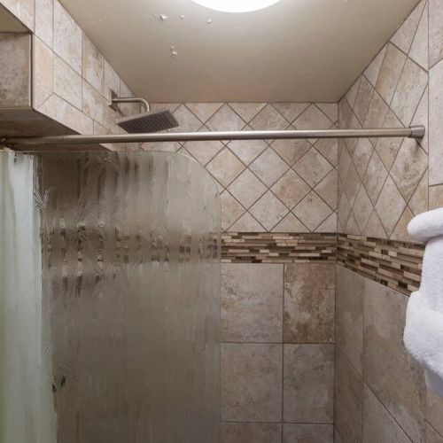 Walk in Shower and fresh linens.