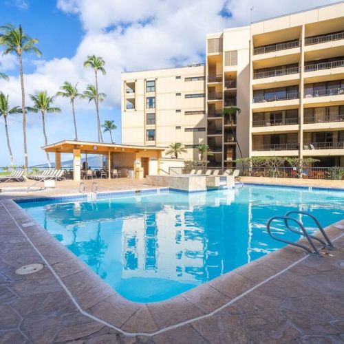Resort pool and plenty of seating.