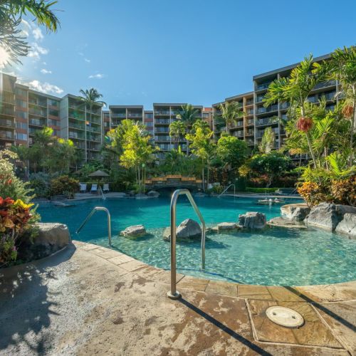 Resort pools with lush tropical grounds