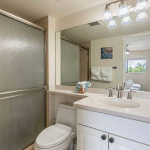 Bathroom off bedroom 2 features walk in shower and luxury organic bath essentials.