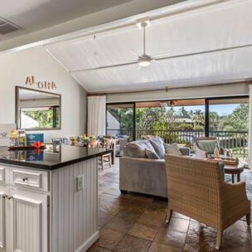 Open floor plan with spacious living area and kitchen