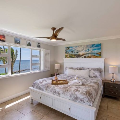 Ocean view bedroom with en suite bathroom.