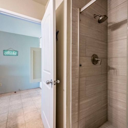 Full bathroom with clean modern walk in shower.