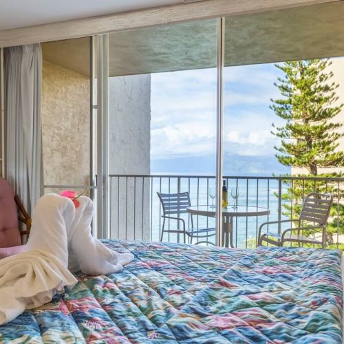 Lay in bed and admire, the ocean, whales, sailboats, and the island of Molokai.