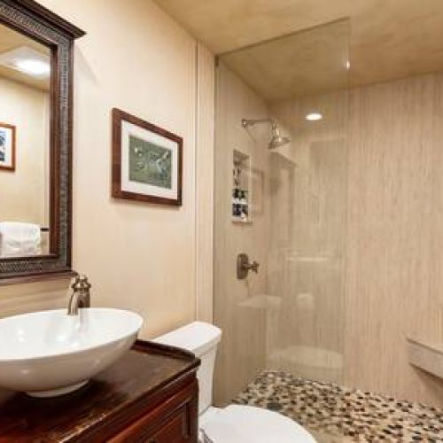 Beautifully remodeled second bathroom with custom walk in shower and luxury organic bath products.