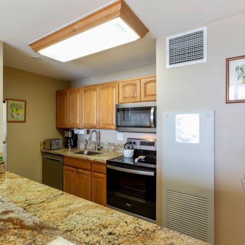 Fully equipped kitchen with upgraded stainless appliances.