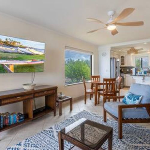 Beautiful coastal aesthetic with sofa sleeper, central AC, ceiling fan, and smart TV with cable