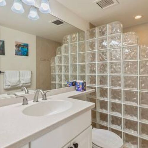 Bathroom 2 with walk in shower with luxury bath essentials courtesy of Stay Aloha