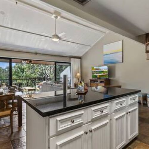 Kitchen overlooks the living are and the large lanai