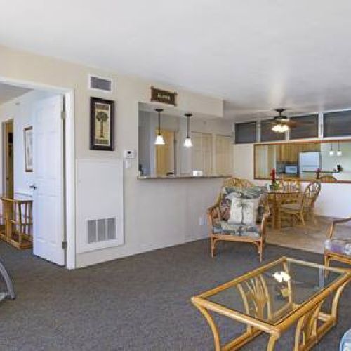 Spacious living area with central AC, smart TV with cable, and plenty of seating